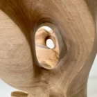 open-arc-walnut-wood-sculpture-detail-opening-ewebohome-ewelina-glowacz Close-up detail of Open Arc walnut wood sculpture showing carved opening and flowing grain patterns