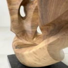 open-arc-walnut-wood-sculpture-granite-base-detail-ewebohome-ewelina-glowacz Detail of Open Arc sculpture showing walnut grain and black granite base