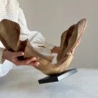 open-arc-walnut-wood-sculpture-hand-scale-photo-ewebohome-ewelina-glowacz Open Arc walnut wood sculpture shown in the artist's hands for scale