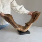 opent-arc-walnut-wood-sculpture-scale-photo-ewebohome-ewelina-glowacz Open Arc walnut wood sculpture shown in the artist's hands for scale