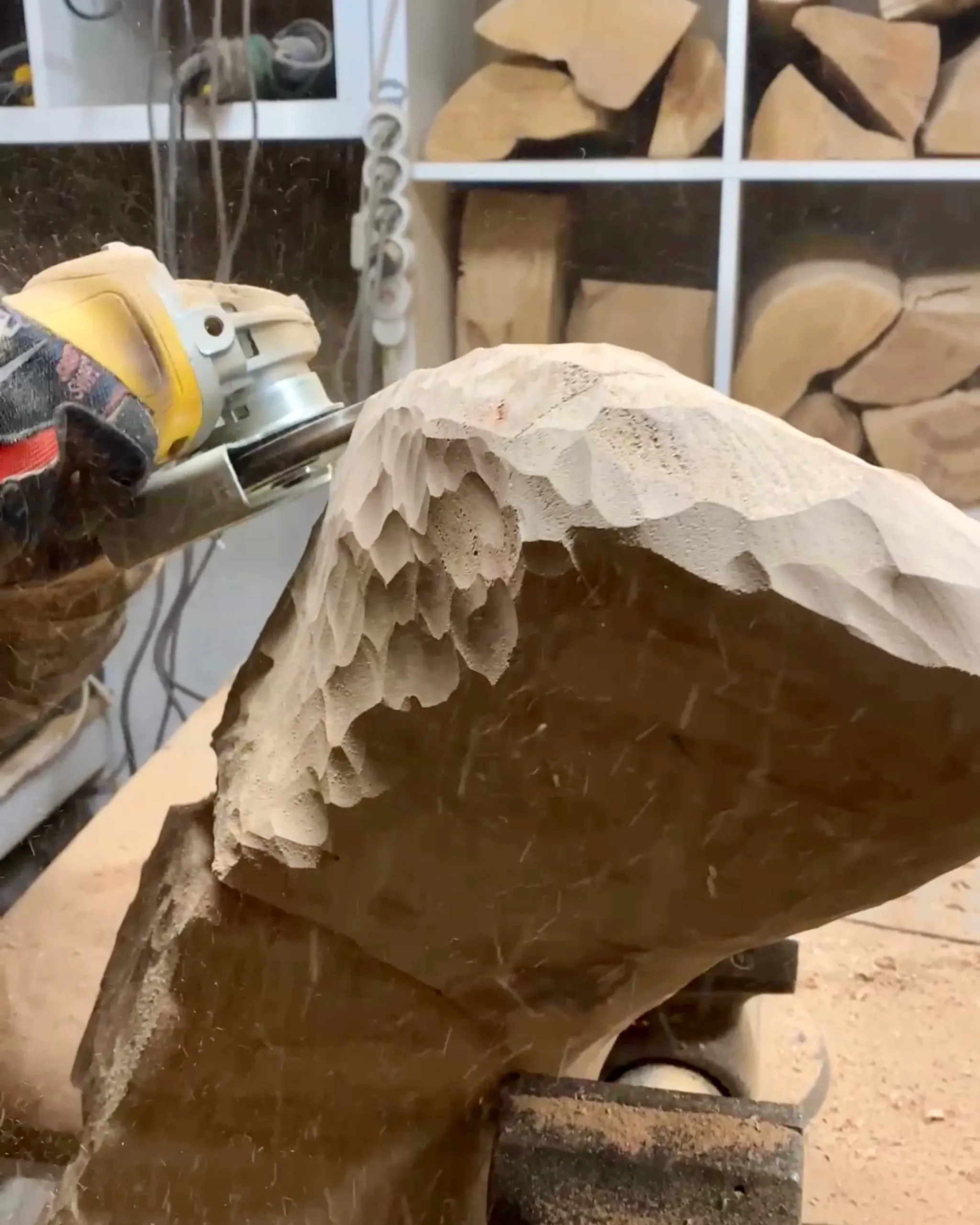 hand carving abstract wood sculpture, shaping walnut with angle grinder