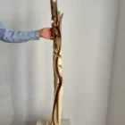 scale view tall wood sculpture walnut hand carved size reference human hand unfolding form