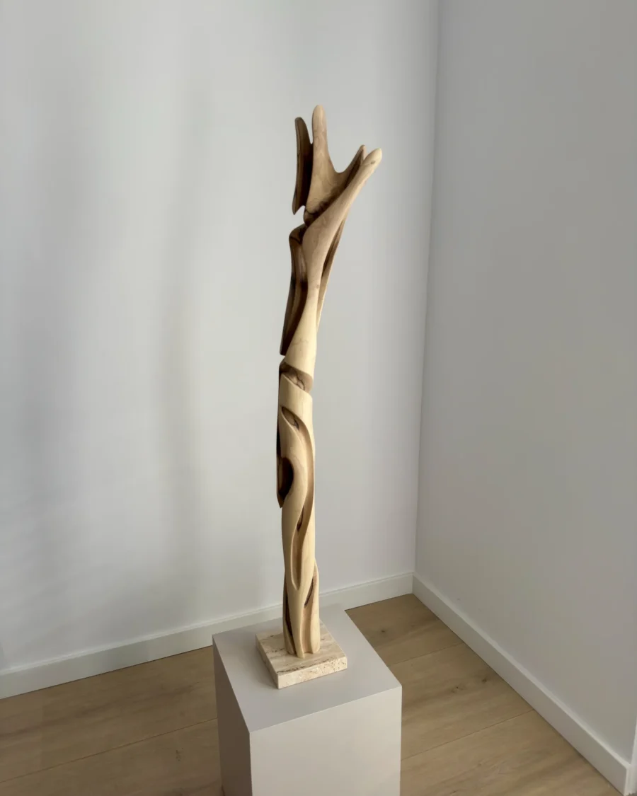 full view tall abstract wood sculpture walnut on pedestal minimalist space unfolding form