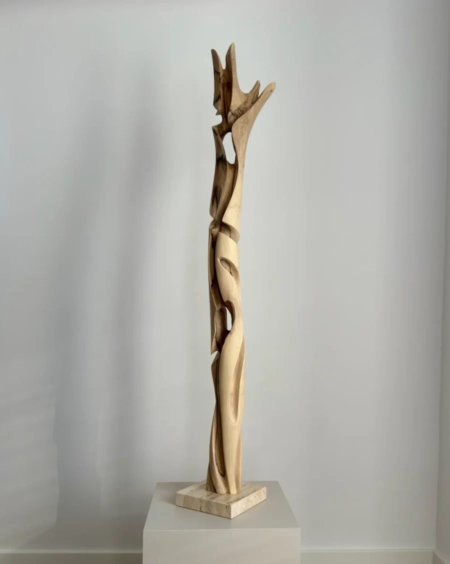 full view tall abstract wood sculpture walnut on pedestal minimalist space unfolding form