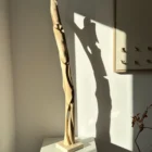 abstract wood sculpture walnut in interior natural light minimalist decor unfolding form