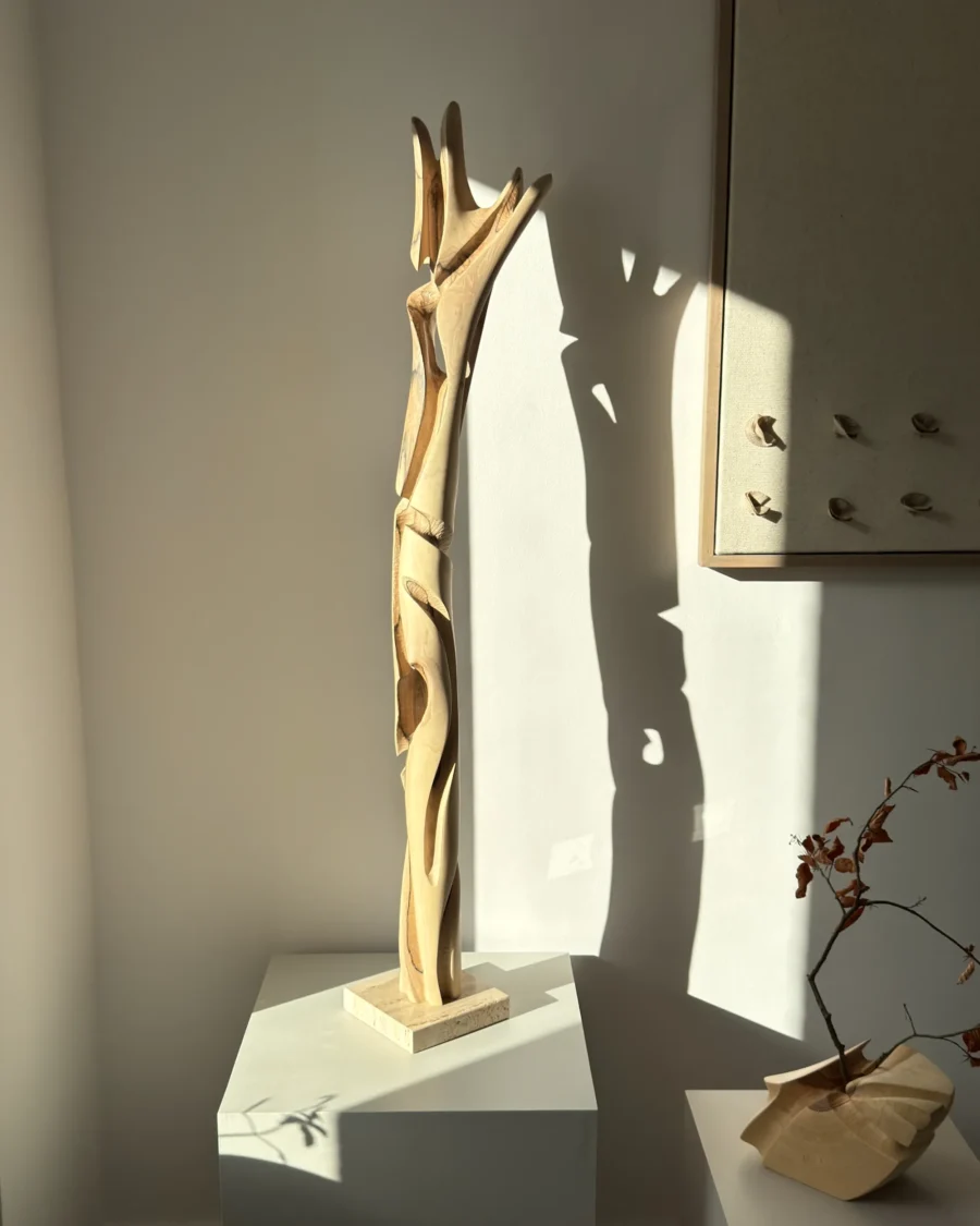 abstract wood sculpture in walnut hand carved tall organic form with light and shadow unfolding form