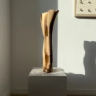 Abstract wood vase with dried pampas grass, hand-carved walnut, sculptural form with soft light and shadow