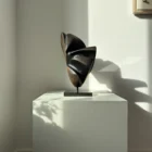 abstract applewood sculpture shadow split side view showing curved planes and dark carved interior