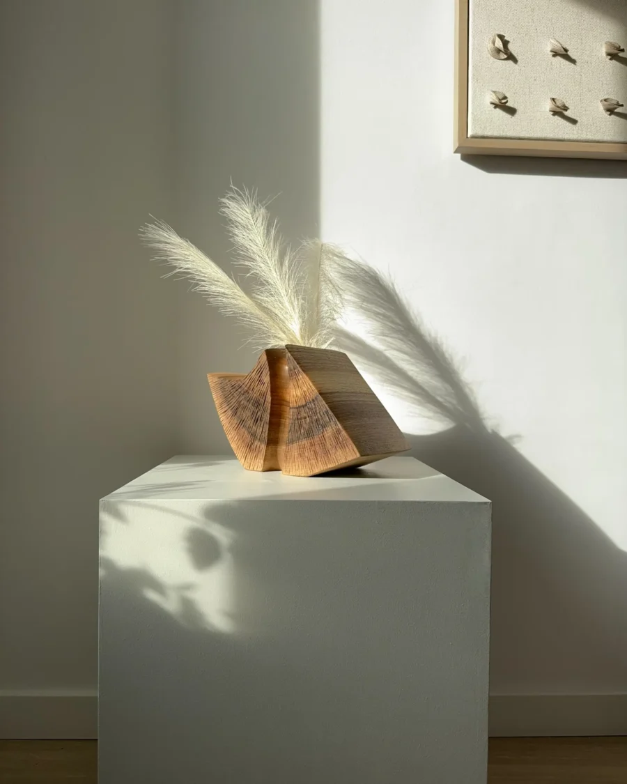 wood sculptural vase walnut held fold hand carved vase with dried pampas in natural light