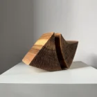 hand carved walnut vase textured surface detail abstract sculptural vessel