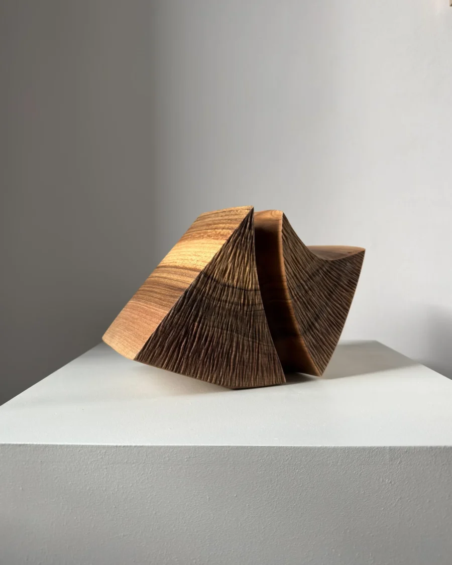 hand carved walnut vase textured surface detail abstract sculptural vessel