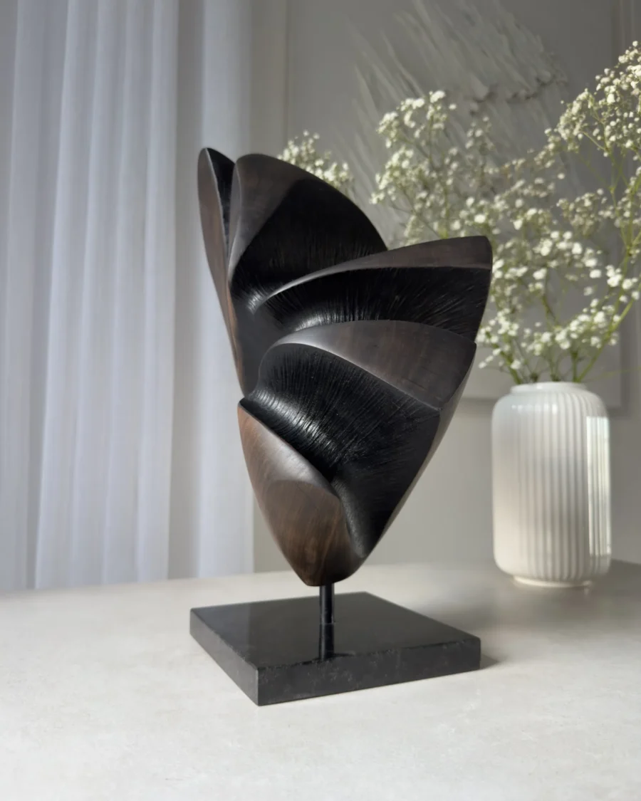 abstract wood sculpture in interior setting applewood sculpture with flowers on table modern space