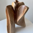 close up of walnut wood grain on hand carved sculpture, natural texture and organic surface detail