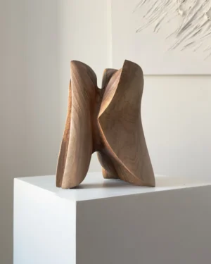 abstract wooden sculpture hand carved from solid walnut, organic flowing form on pedestal, modern minimalist wood art