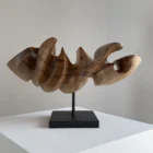 Abstract wood sculpture "Point of Hold" in walnut, front view showing smooth curved planes and light natural tones on granite base