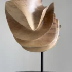 Modern abstract wood sculpture in walnut, full view showing balanced asymmetrical form and clean lines