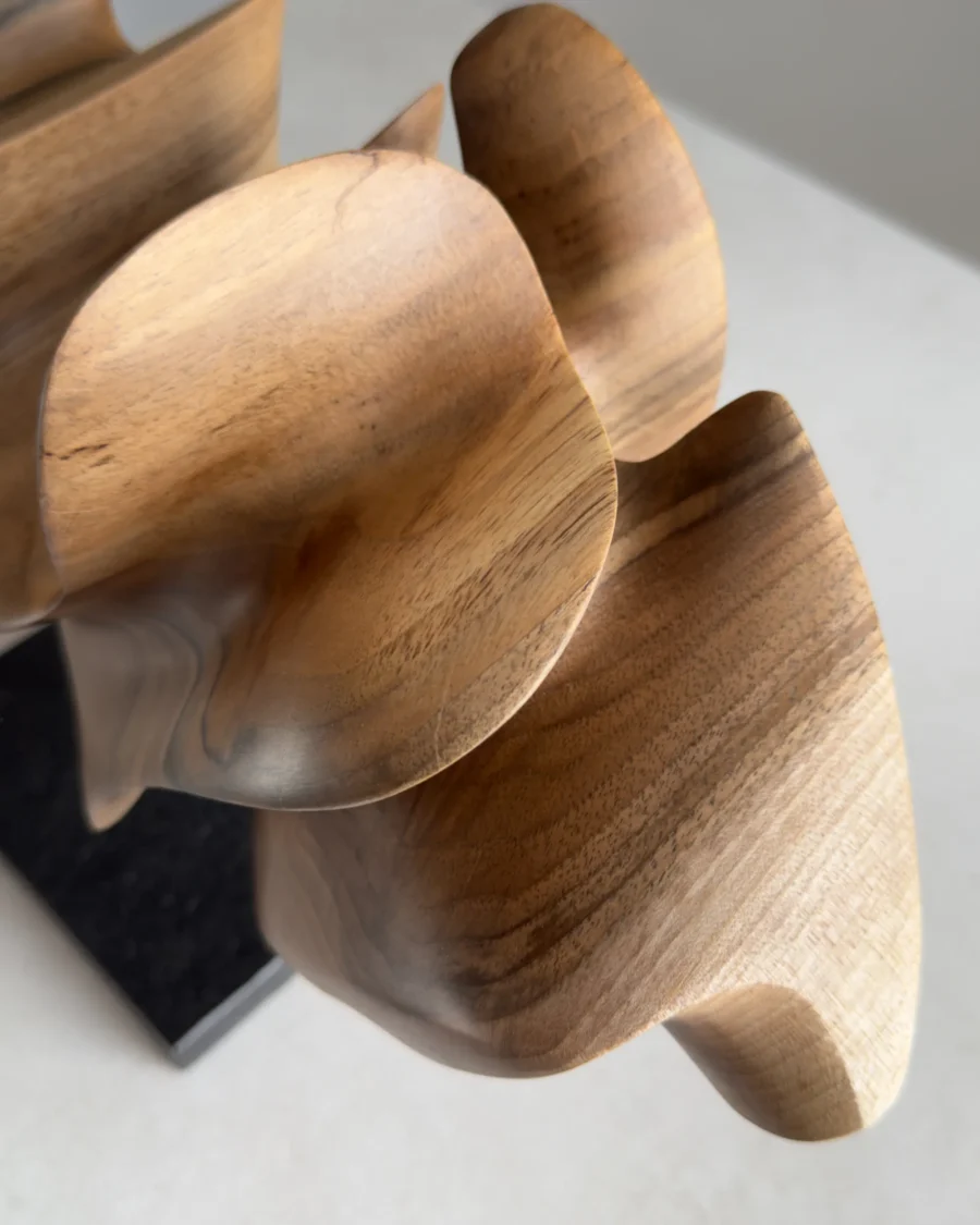 Close up of light walnut surface showing smooth finish and subtle natural grain pattern