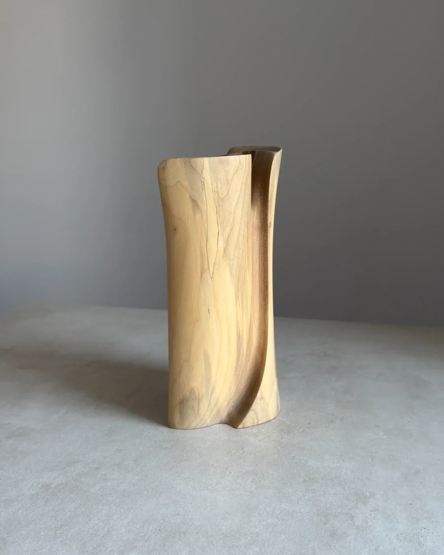 Hand-carved walnut vase, abstract wooden form with vertical grain and natural tones
