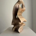 Abstract walnut wood sculpture “Almost Free” – hand carved modern wooden sculpture, organic form in natural light