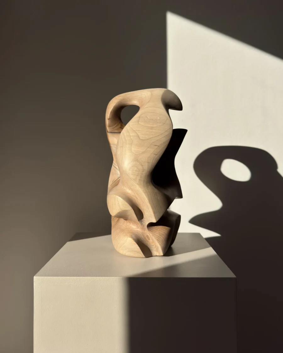 Hand carved walnut sculpture with dramatic light and shadow – minimalist interior art object