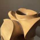 abstract-wood-sculpture-walnut-ethereal-motion-detail hand carved wooden sculpture detail smooth curved surface