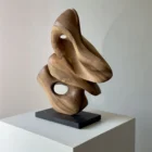 abstract wood sculpture Morphia hand carved from walnut shown in natural light