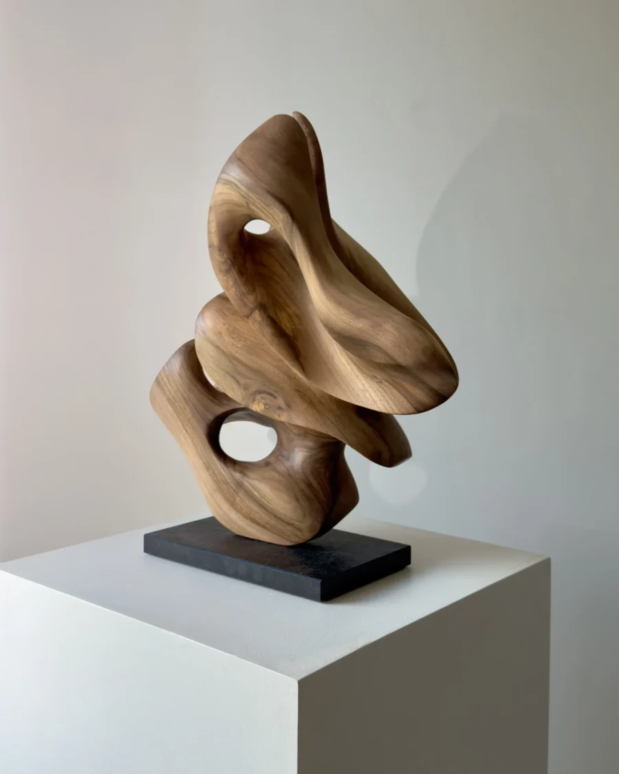 abstract wood sculpture Morphia hand carved from walnut shown in natural light