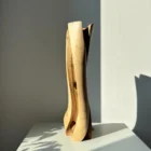 abstract-wood-vase-walnut-leaning-form-main abstract wood vase hand carved from walnut with a subtle leaning form in natural sunlight