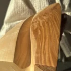 Close up of ash wood grain in hand carved vase, natural pattern and texture