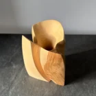 Top view of ash wood vase, hollow interior carved from solid wood