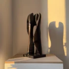 modern wooden sculpture detail smooth and textured surface contrast