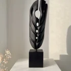 ember-guardian-abstract-wood-sculpture-front Abstract black wood sculpture Ember Guardian front view on pedestal