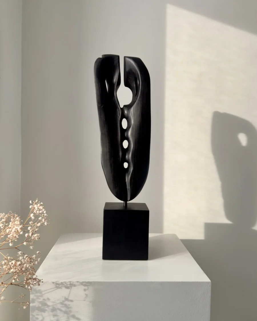 ember-guardian-black-wood-sculpture-interior-opening Charred wood sculpture showing organic form and carved openings