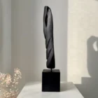 ember-guardian-charred-wood-sculpture-angle Hand carved apple wood sculpture with charred black surface in natural light