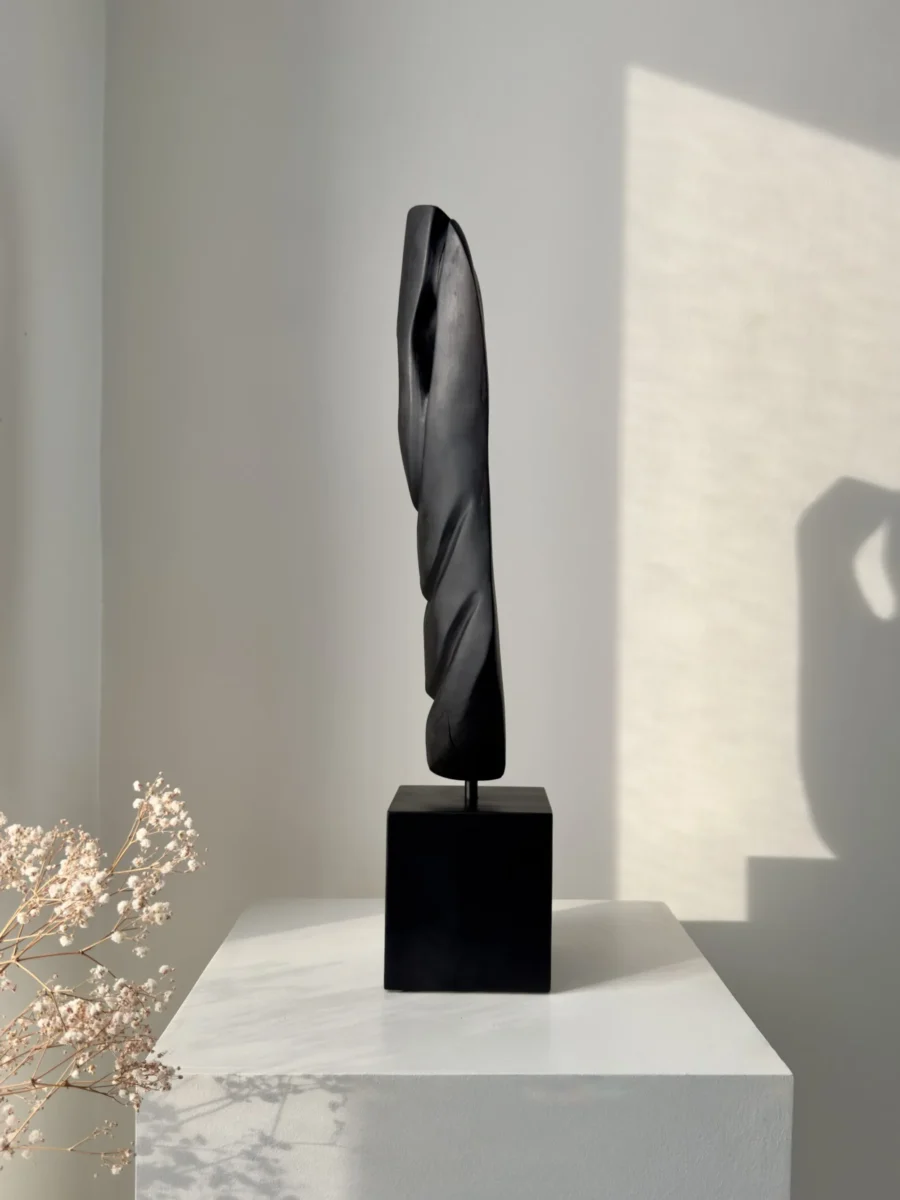 ember-guardian-charred-wood-sculpture-angle Hand carved apple wood sculpture with charred black surface in natural light