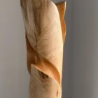 Detail of maple wood grain and smooth carved surface