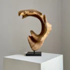 quiet-arc-walnut-wood-sculpture-main-ewebohome-ewelina-glowacz Hand carved walnut wood sculpture "Quiet Arc" on light background, abstract organic form with flowing curves and light shadow contrast