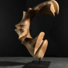 quiet-arc-wood-sculpture-back-view Abstract walnut wood sculpture side view, hand carved organic form with smooth flowing lines and sculptural depth