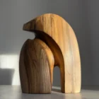 Abstract walnut sculpture Quiet Endurance showing flowing organic forms and natural grain