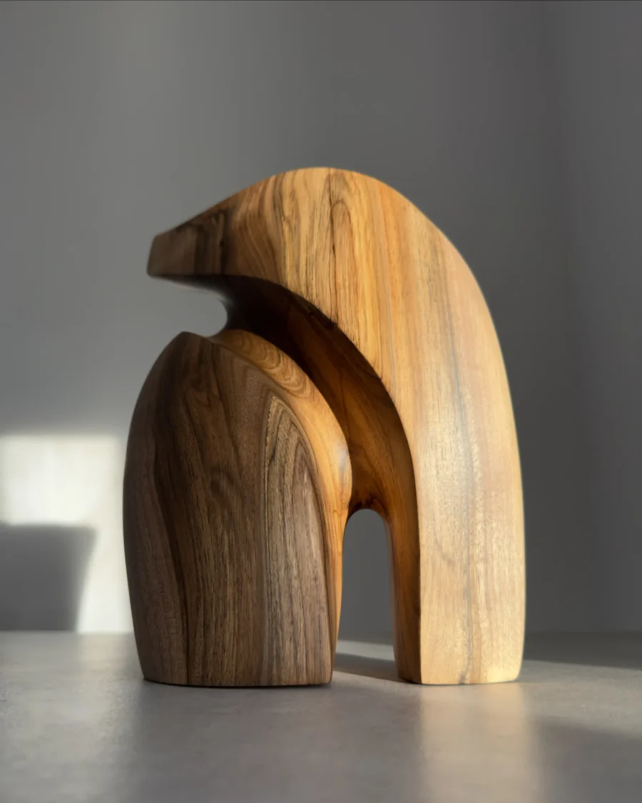 Abstract walnut sculpture Quiet Endurance showing flowing organic forms and natural grain