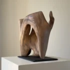 rebirth-wood-sculpture-full-view-ewebohome a wooden sculpture on white pedestal to show scale and carved structure.