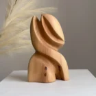 abstract pear wood sculpture Seed Form with soft decorative background