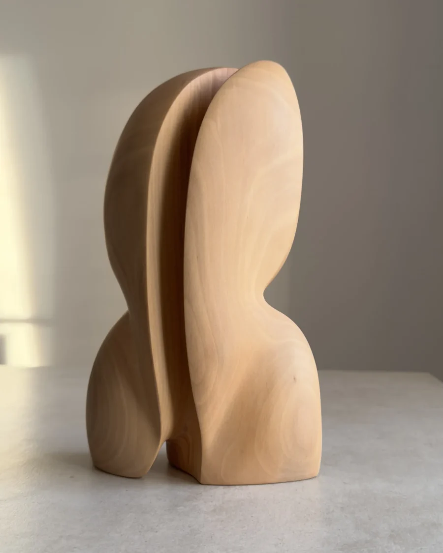 minimalist wood sculpture pear wood smooth carved form close view
