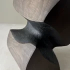 close up apple wood vase yakisugi charred texture and smooth surface contrast