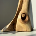 walnut-wood-vase-grain-detail-natural-light walnut wood vase base detail with natural grain patterns highlighted by sunlight