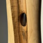 wood-vase-glass-tube-detail detail of walnut wood vase with visible glass tube inside carved opening