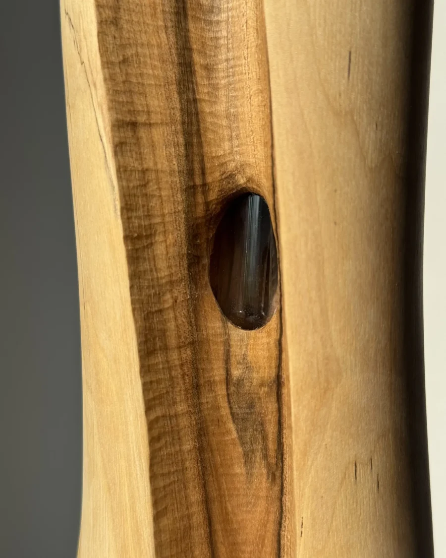 wood-vase-glass-tube-detail detail of walnut wood vase with visible glass tube inside carved opening