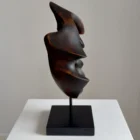 flame-memory-organic-wood-sculpture-profile-view Profile view of hand-carved walnut wood sculpture with blackened surface and flame-like organic form
