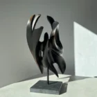 abstract-wood-sculpture-black-apple-wood-main Hand carved apple wood sculpture Inner Tension, front view with soft natural light