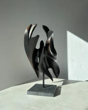 abstract-wood-sculpture-black-apple-wood-main Hand carved apple wood sculpture Inner Tension, front view with soft natural light